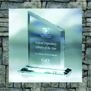 Glass trophy with base and text with federal depository library of the year