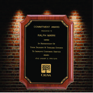 Commemorative plaque with black background and gold text